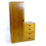 An early / mid 20thC oak wardrobe / dressing chest. Having a single long door opening to show