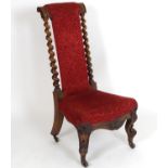 A late 19thC mahogany prie due with a shaped upholstered top flanked by barley twist supports and