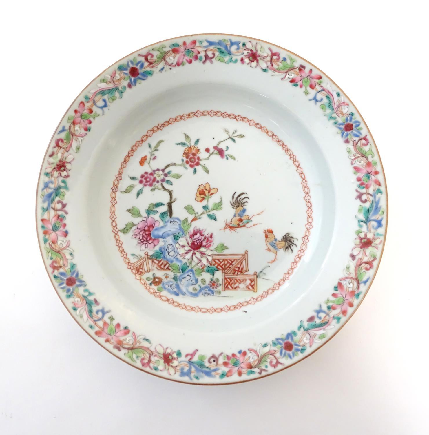 A pair of Chinese dishes decorated with a garden / terrace scene with flowers and foliate with two - Image 6 of 6