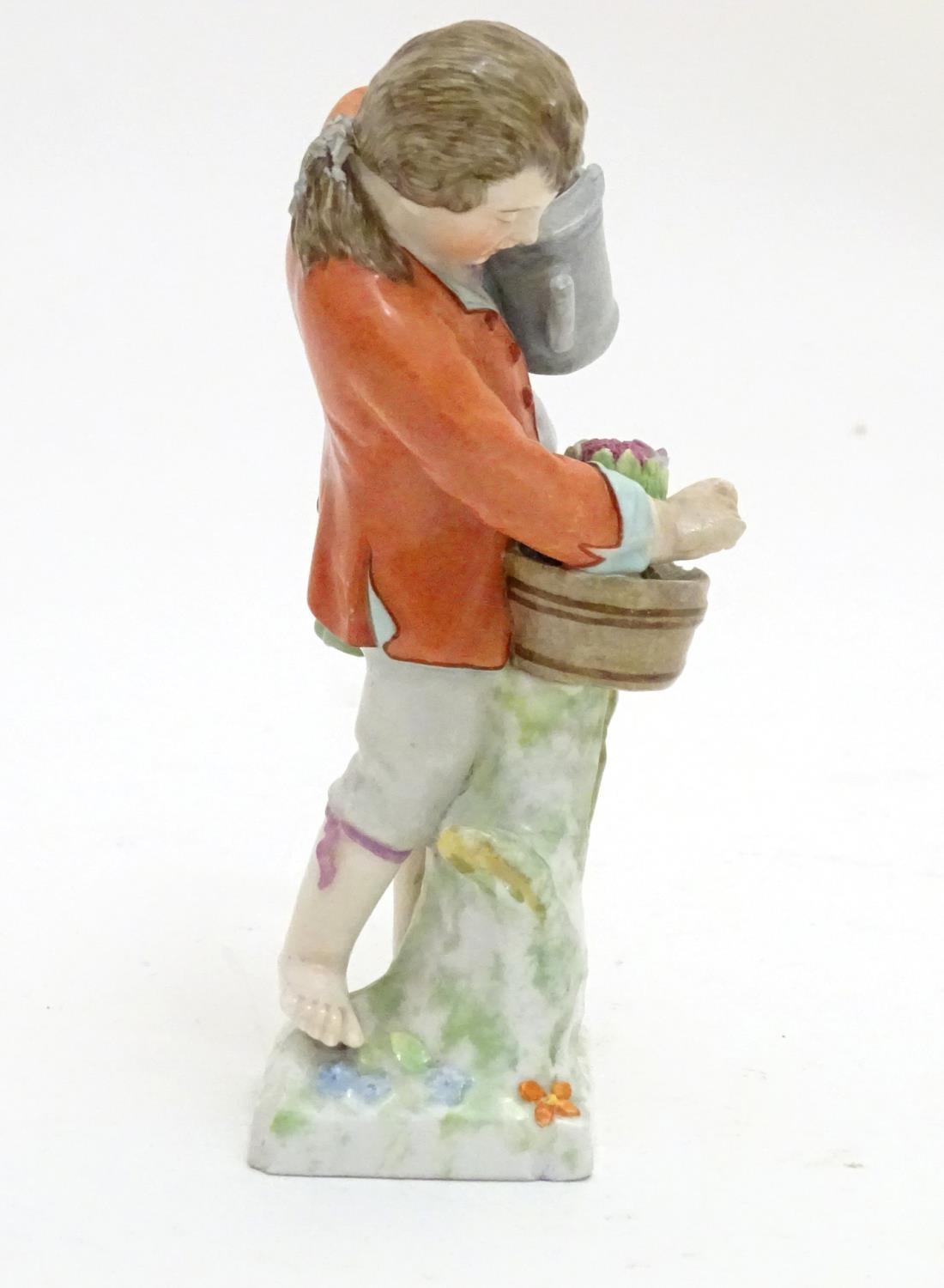 A Continental porcelain figure modelled as a boy with a watering can tending to a pot of flowers. - Image 4 of 6