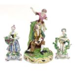 A Derby porcelain figural group with two figures, a kneeling gentleman fitting a slipper on a