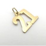 A yellow metal '21' coming of age pendant 1/2" high. Please Note - we do not make reference to the