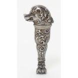 A Continental white metal hand seal formed with stylised dog head decoration and seal under. Approx.
