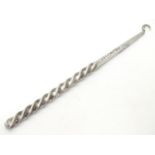 An American sterling silver button hook with twist handle. Maker?s mark for George W. Shiebler & Co.