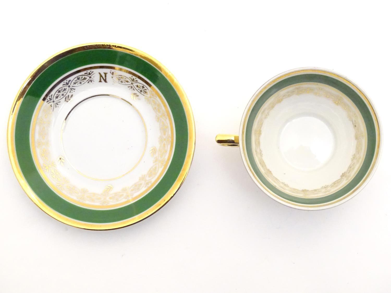 A French tea cup and saucer depicting Emperor Napoleon with green and gilt highlights. Porcelaine de - Image 6 of 10