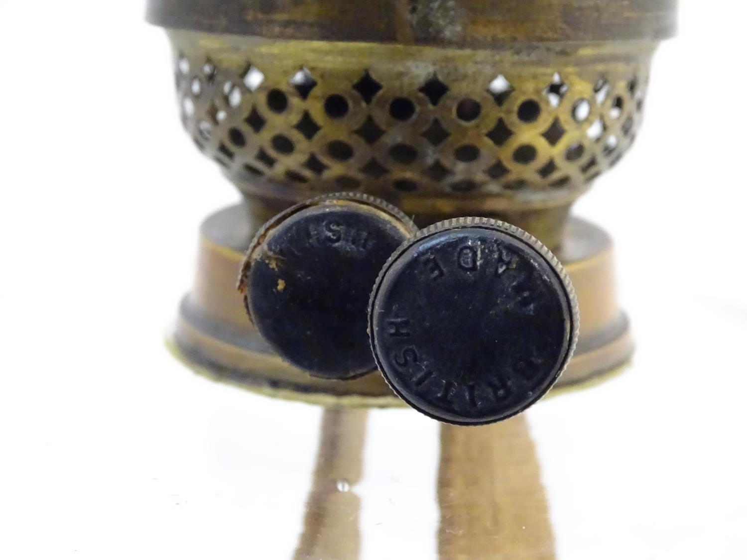 A late 19thC / early 20thC oil lamp, the brass column on stepped base supporting a clear cut glass - Image 5 of 9
