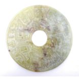 A Chinese carved soapstone bi disk / roundel. Approx. 7" diameter Please Note - we do not make