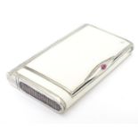 A Continental .900 silver cigarette box with hinged central cigarette section , with further vesta
