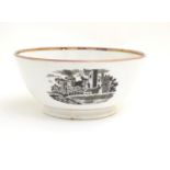 A 19thC bowl with monochrome transfer decoration depicting a river landscape with a ship and