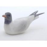 A Royal Copenhagen model of a seagull bird, model no. 1468. Marked under. Approx. 2 1/4" high Please
