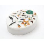 A 20thC alabaster oval box with pietra dura floral and foliate inlay. Approx. 1 1/4" high Please