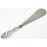 A silver handled shoe horn hallmarked Birmingham 1904 maker Crisford & Norris. 8 1/4" long Please