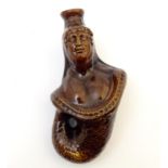 A 19thC brown treacle glazed gin spirit flask formed as a mermaid. Approx 7 1/2" long Please