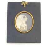 A 19thC oval watercolour portrait miniature depicting a young lady wearing a bonnet. Approx. 6 1/