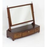 A 19thC mahogany dressing table mirror, having reeded supports surmounted by brass finials, the base