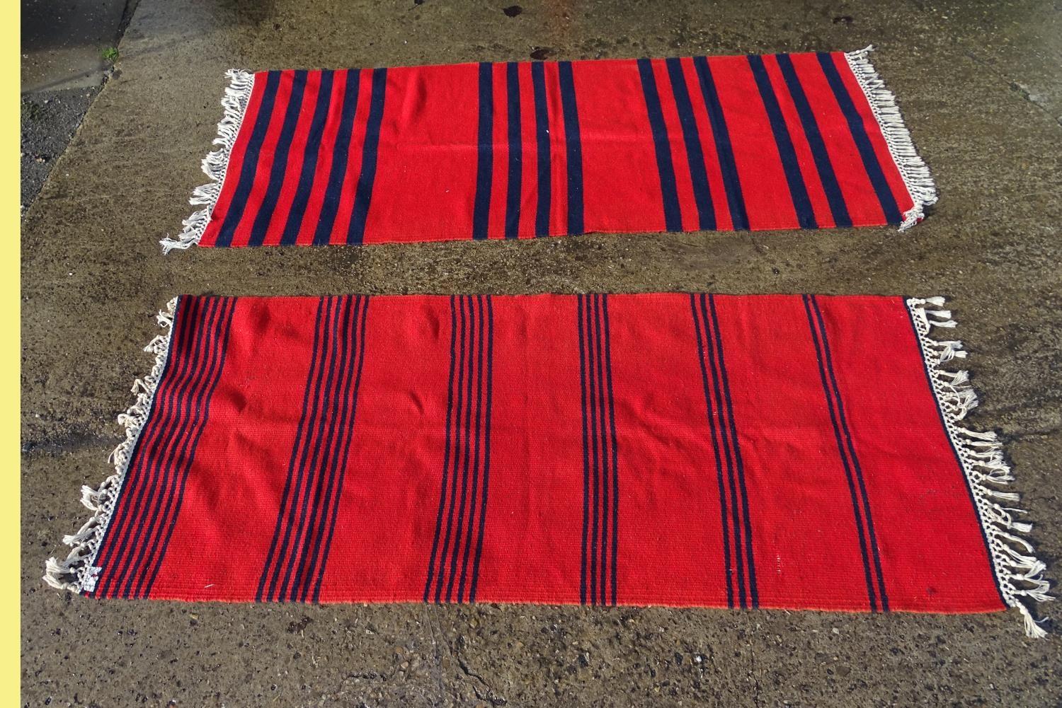 Two hand woven rugs / runners with red and navy blue stripes. One with label designed and hand woven