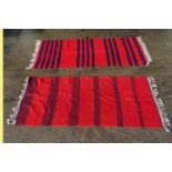 Two hand woven rugs / runners with red and navy blue stripes. One with label designed and hand woven