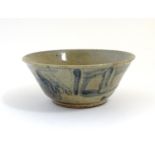 A Chinese crackle glaze bowl with blue brushwork detail. Approx. 3 3/4" high x 8 3/4" diameter