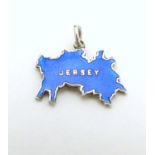 A silver pendant charm formed as the Channel Island Jersey and decorated with blue guilloche