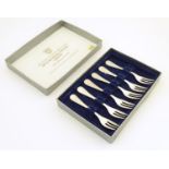 A set of six .800 silver cake forks. Approx. 5" long Please Note - we do not make reference to the