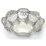 A silver bon bon dish with pierced and embossed decoration. Hallmarked Birmingham 1896 maker Henry