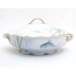 A late 19thC Rosenthal oval scallop shaped tureen with a lobed gilt edged rim, decorated with