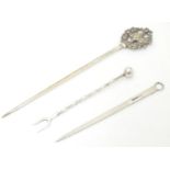Two various silver plate meat / game skewers together with a pickle fork. The longest 9 1/4" (3)