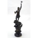 A 20thC French cast sculpture depicting a woman atop a lion holding aloft a star. On a socle with