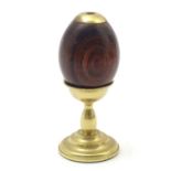 A late 20thC American novelty kaleidoscope formed as an egg on a brass stand, stamped Van Cort