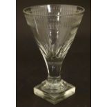A 19thC drinking glass with engraved monogram ducal crow and squared base Approx 5" high Please Note