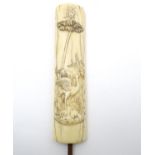 A late 19thC ivory parasol handle with carved wetland landscape scene with crane bird and frog