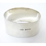 A silver napkin ring of ovoid form hallmarked Birmingham 1924 maker Henry Williamson Ltd. Please