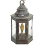 An Arts and Crafts pendant light of copper lantern form with pierced gallery with heart detail