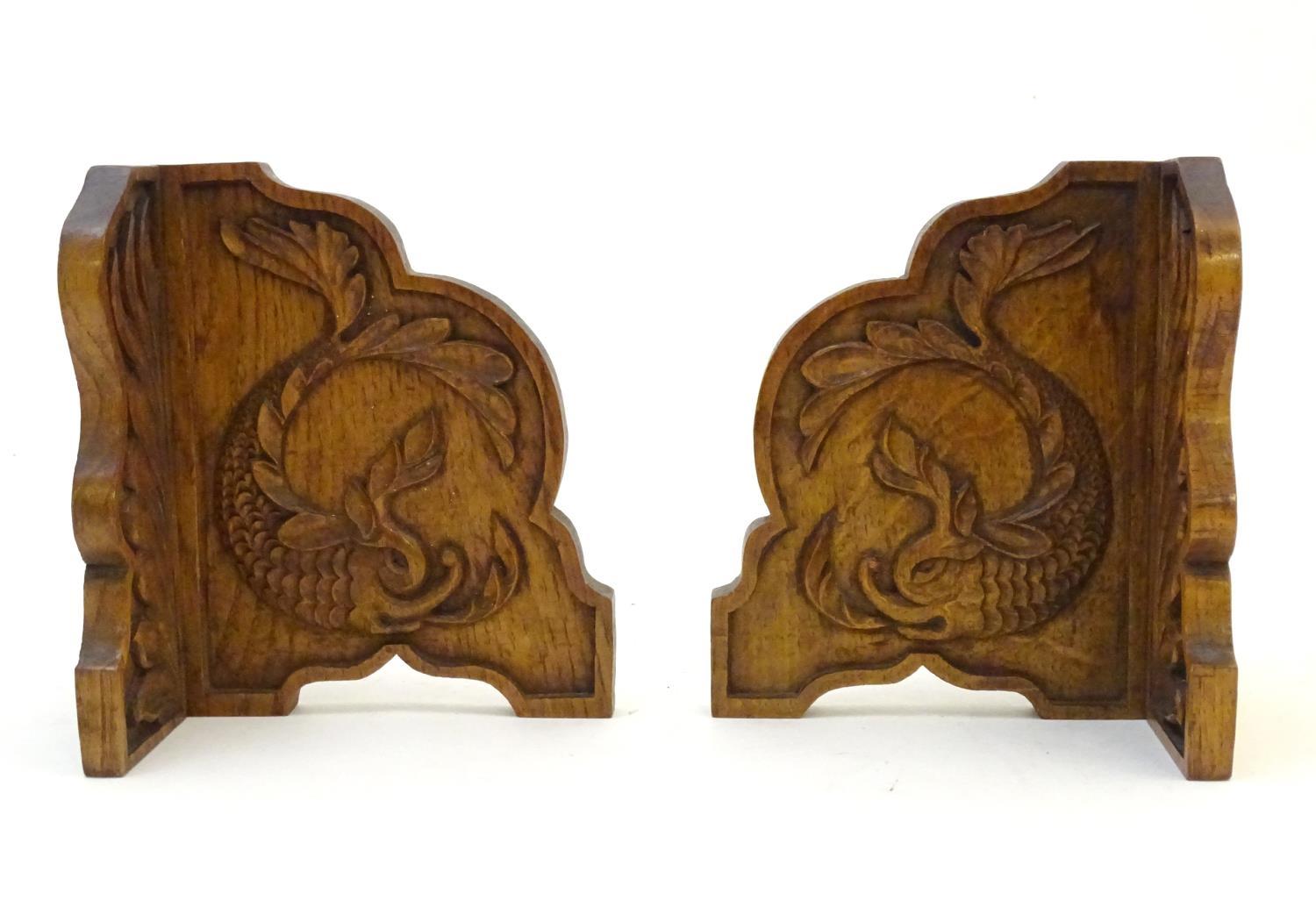 A pair of 20thC bookends with carved fish detail. Approx. 8" long (2) Please Note - we do not make - Image 2 of 7