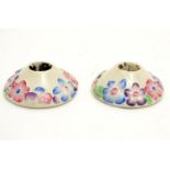 A pair of Clarice Cliff candle holders from the My Garden Verdant series with relief floral