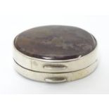 A 19thC white metal vinaigrette of oval form set with agate hardstone to lid, opening to reveal a