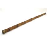 A late 19th / early 20thC hollow bamboo cane / stick, with unscrewing knop, possibly for
