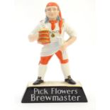 A Brewing advertising figure by Carlton Ware titled ' Pick Flowers Brewmaster ' 9 1/2" high Please