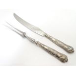 A silver handled Kings Pattern carving knife and fork. Hallmarked Sheffield 1970 maker Harrison