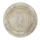 A sycamore bread board with wheatsheaf decoration, signed under 'Chinecy' 11 1/2" diameter Please