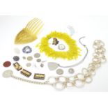 A quantity of assorted jewellery etc. to include brooches, necklaces, etc. Please Note - we do not