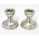 A pair of short silver candlesticks. Hallmarked Birmingham 1970 maker W I Broadway & Co 2 1/4"