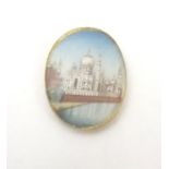 A small cabochon depicting a miniature hand painted scene depicting the Taj Mahal. Approx. 3/4" long