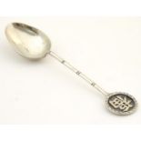 Chinese export silver : A white metal teaspoon with Oriental character mark to handle to finial,