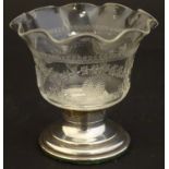An early 20thC small glass dish with etched decoration and flared rim, on a silver pedestal base