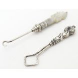 A mother of pearl handled button / glove hook, approx. 3" long. Together with an unusual silver