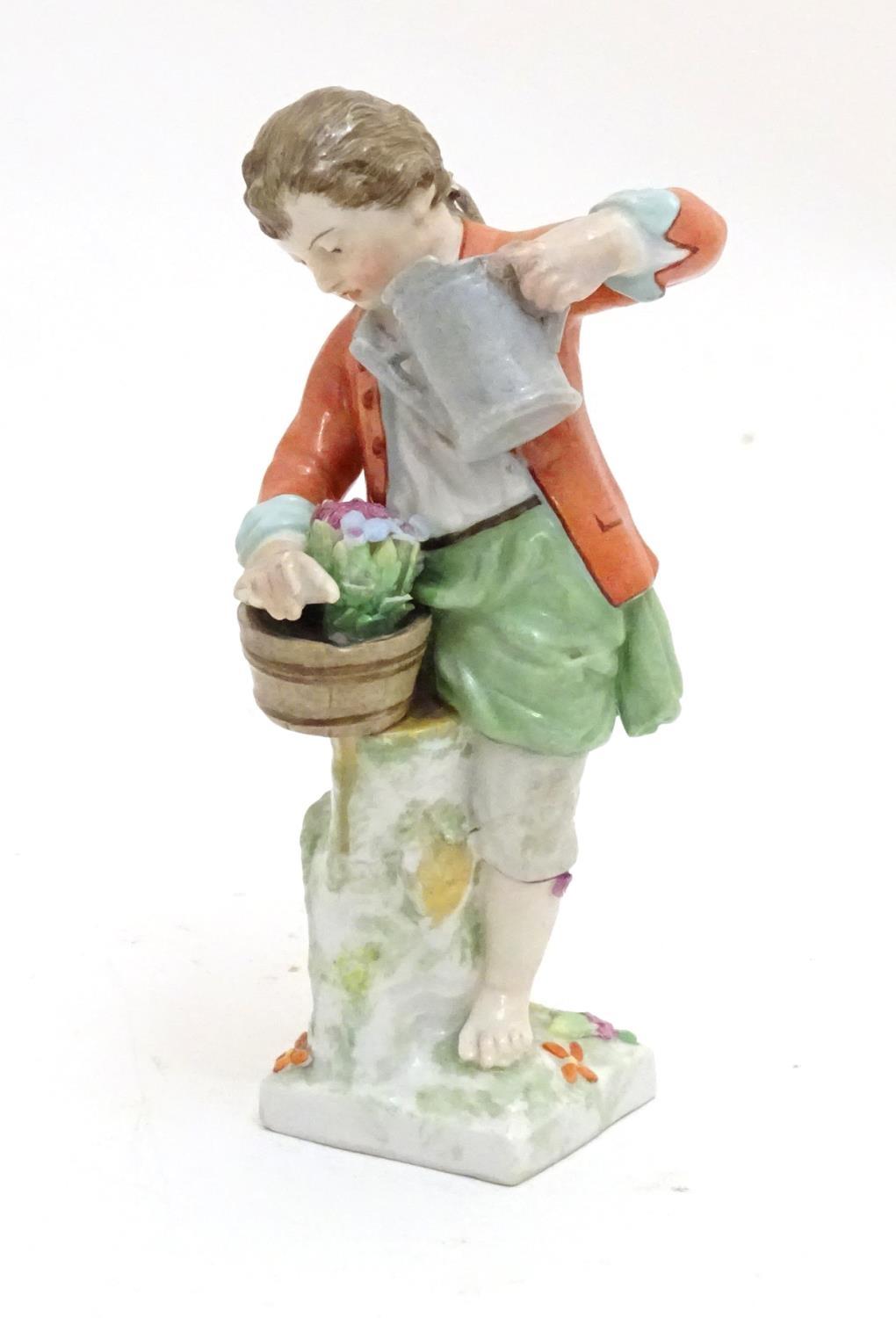 A Continental porcelain figure modelled as a boy with a watering can tending to a pot of flowers. - Image 3 of 6