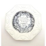 A 19thC monochrome nursery plate of octagonal form, decorated with a floral and foliate wreath, a