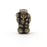 A Japanese brass ojime bead formed as a laughing figure. Approx. 5/8" Please Note - we do not make