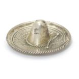 A Mexican silver souvenir model of a sombrero sombrero. 2 1/4" wide Please Note - we do not make